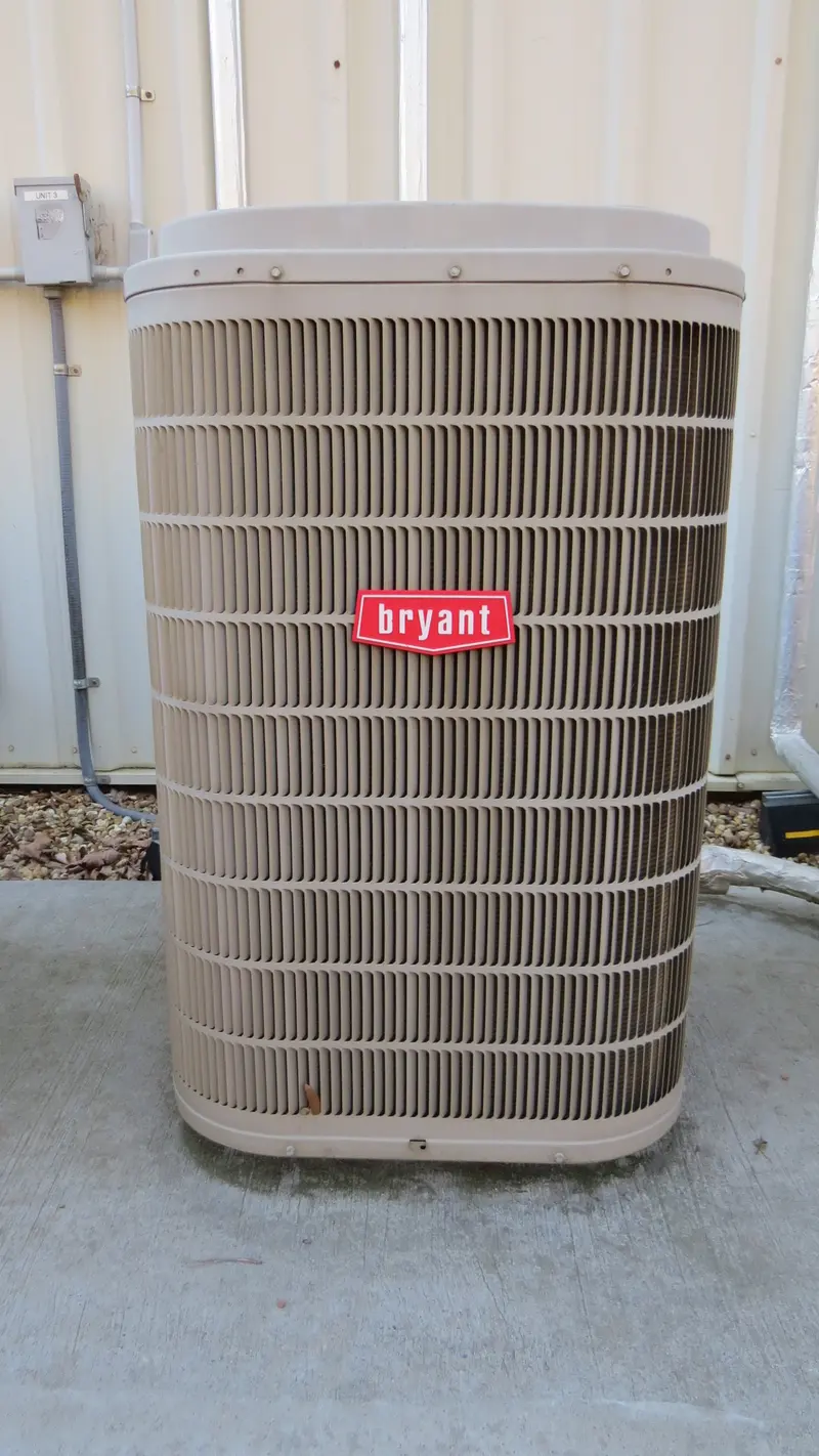A Bryant air conditioning condenser outside a building
