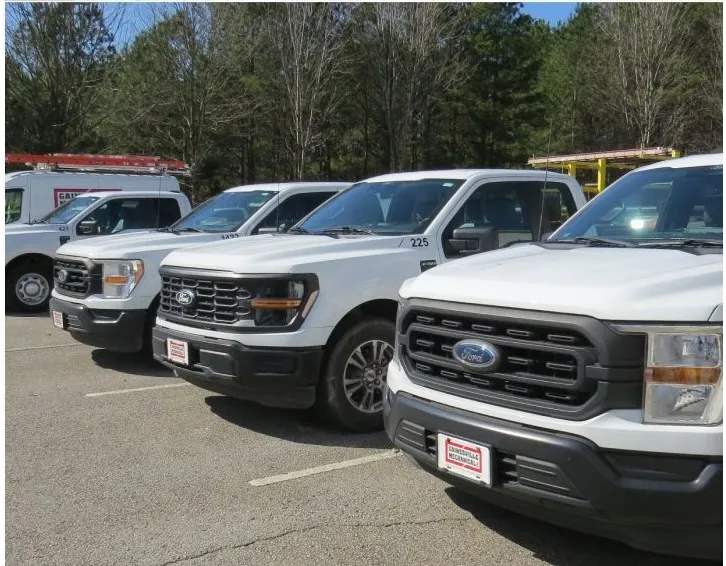 Gainesville Mechanical service trucks lined up in the lot