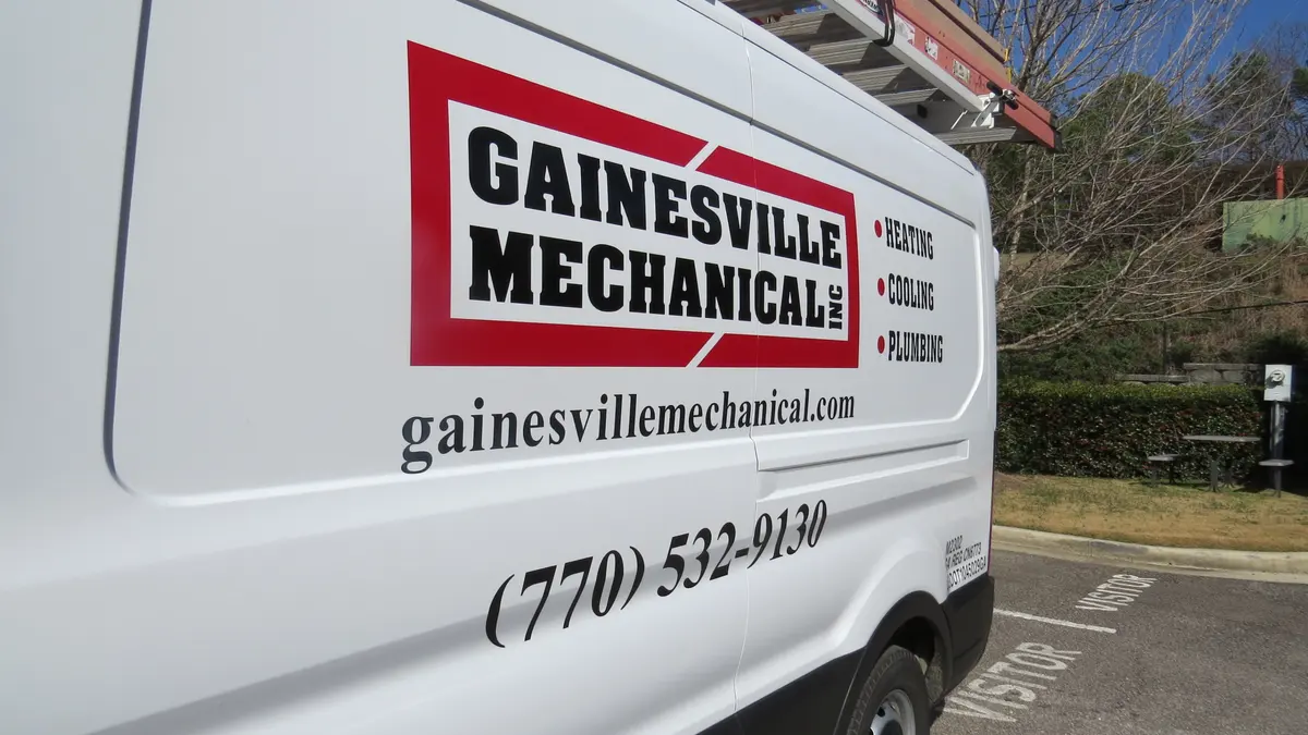 A Gainesville Mechanical service van with the company logo and phone number